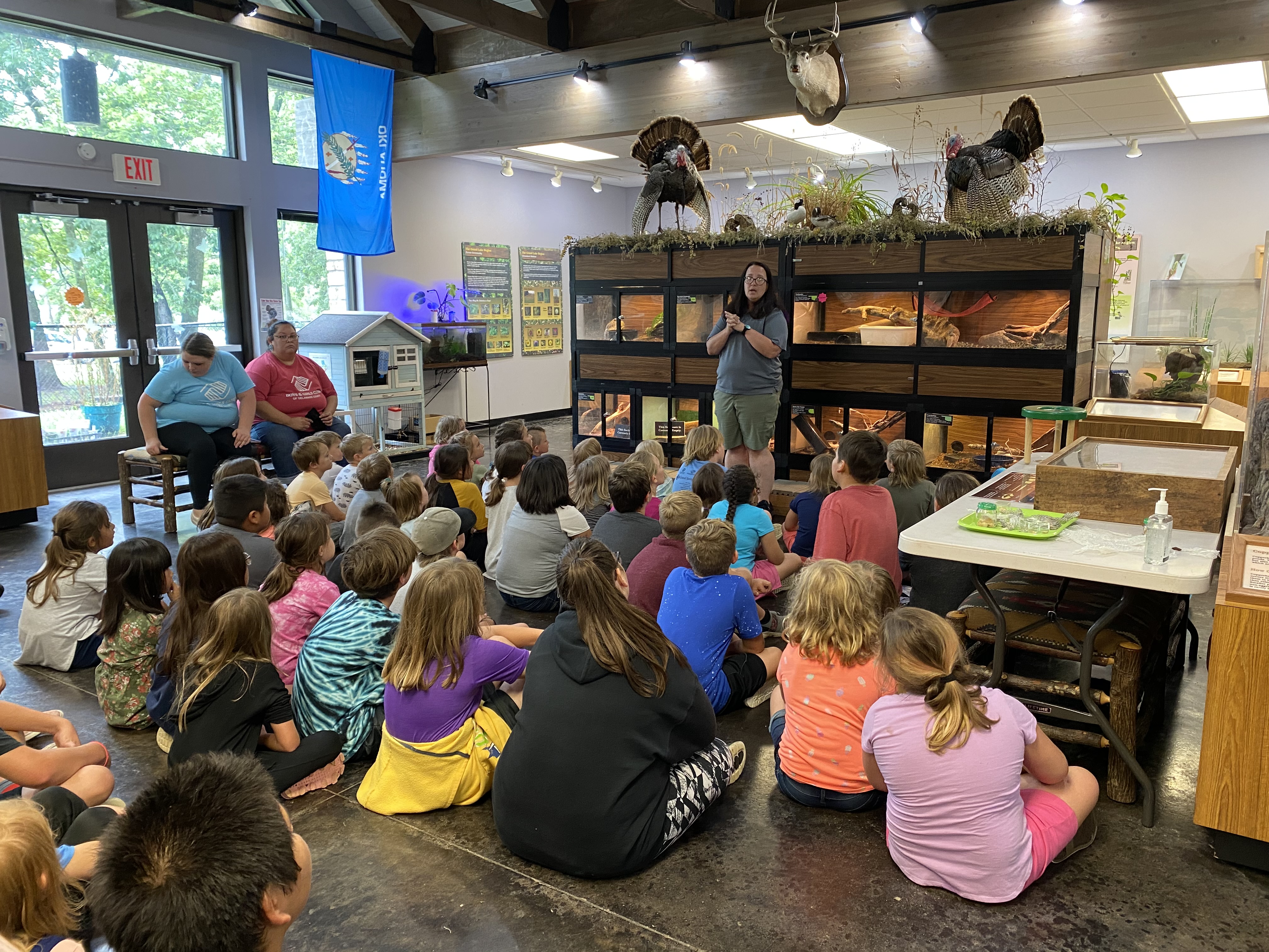 NatureMuseum Boys & Girls Club members and volunteers at a nature museum