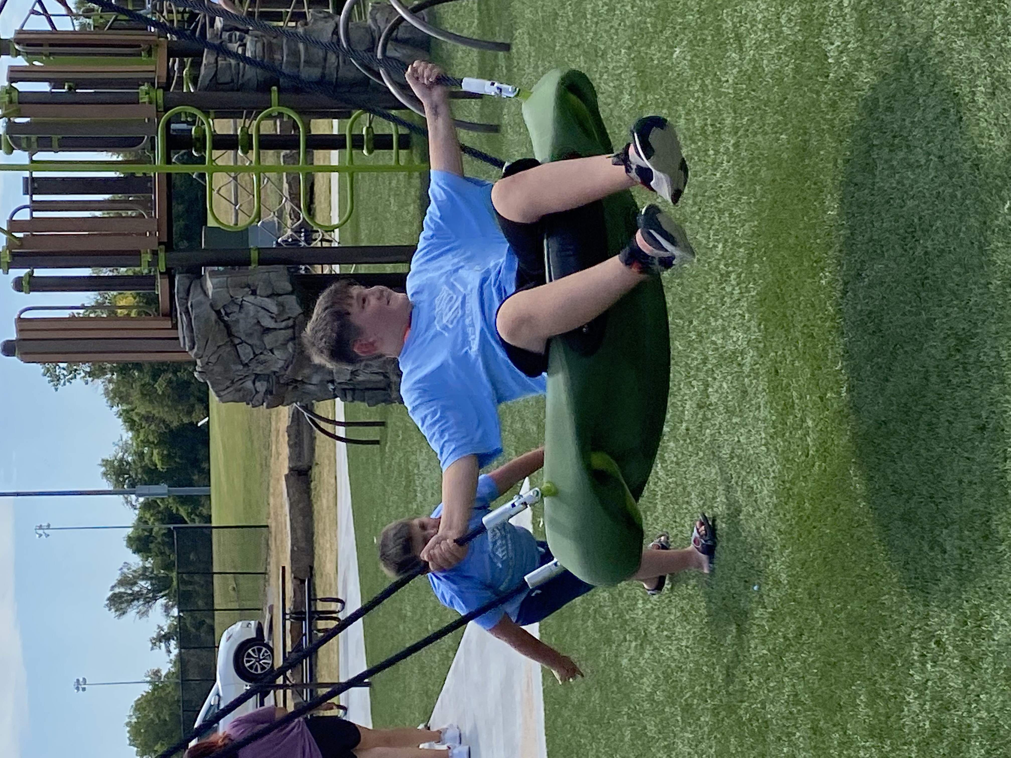 BGC_swing Boys & Girls Club members at a playground.
